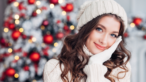 Woman receiving a glowing holiday facial treatment at a luxury med spa
